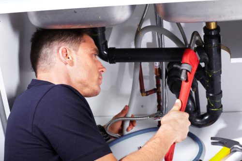 plumber-fixing-drain