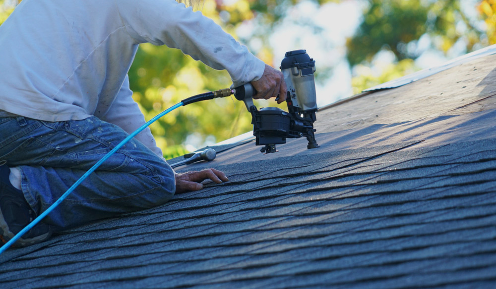 Man Repairing Roof