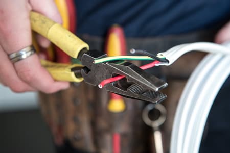 Thomastown electrician stripping cable for home rewiring