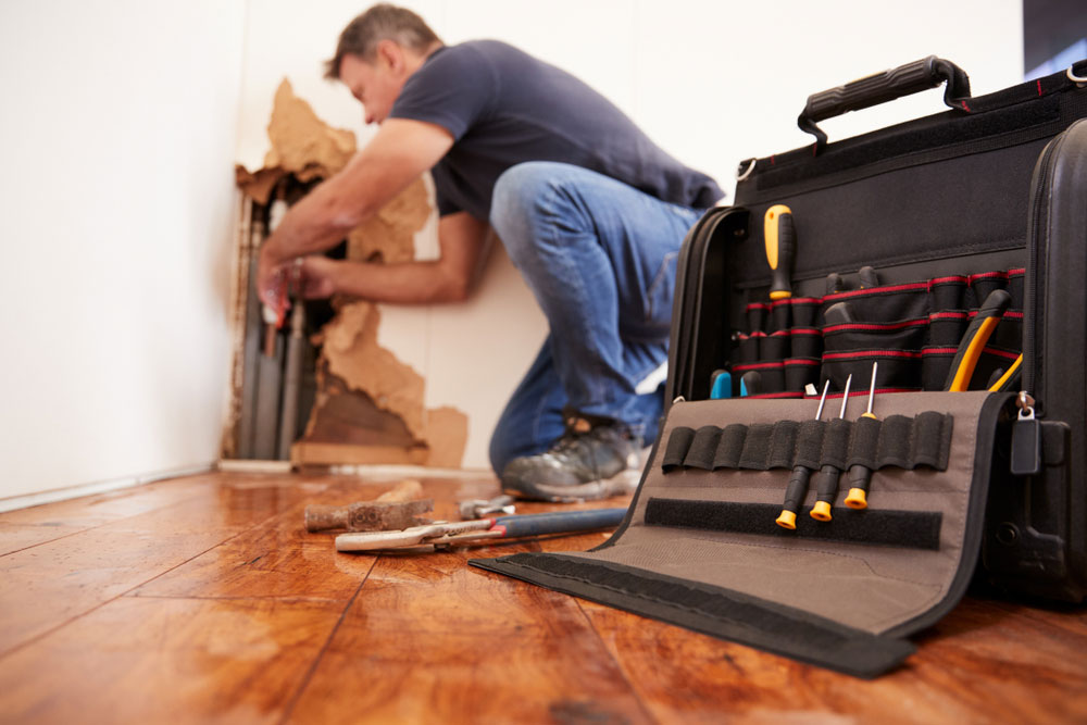 plumber-repairing-burst-pipe
