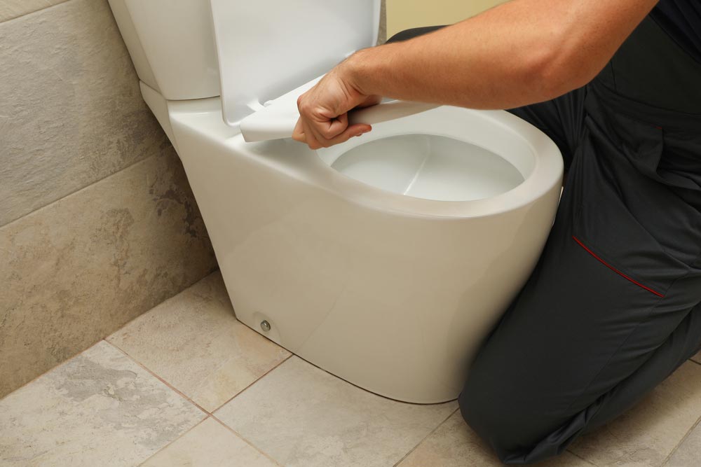 Plumber Fixing Toilet — O'Brien Plumbing Maroochydore in Kunda Park, QLD