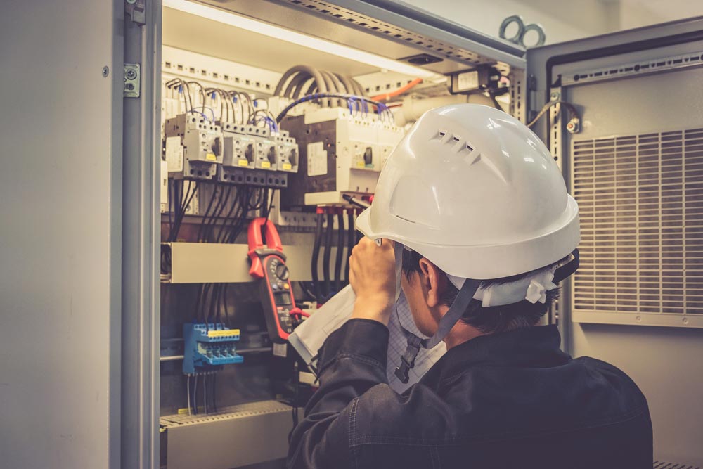 Electrician Checking The Control Panel