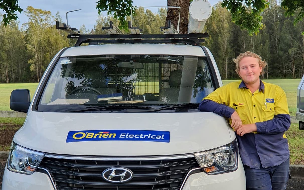 residential electrician next to work van taree