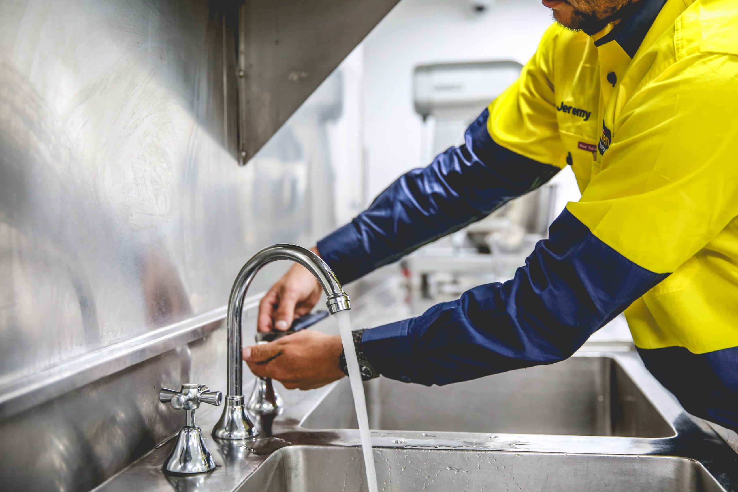 plumber-fixing-sink
