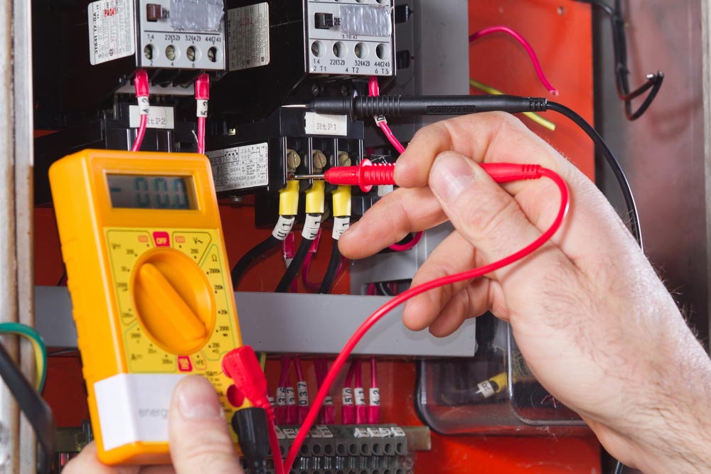 Electrician Checking The Electrical Panel
