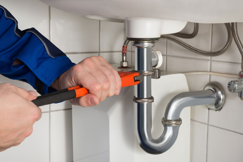 Plumber Fixing Sink Fittings