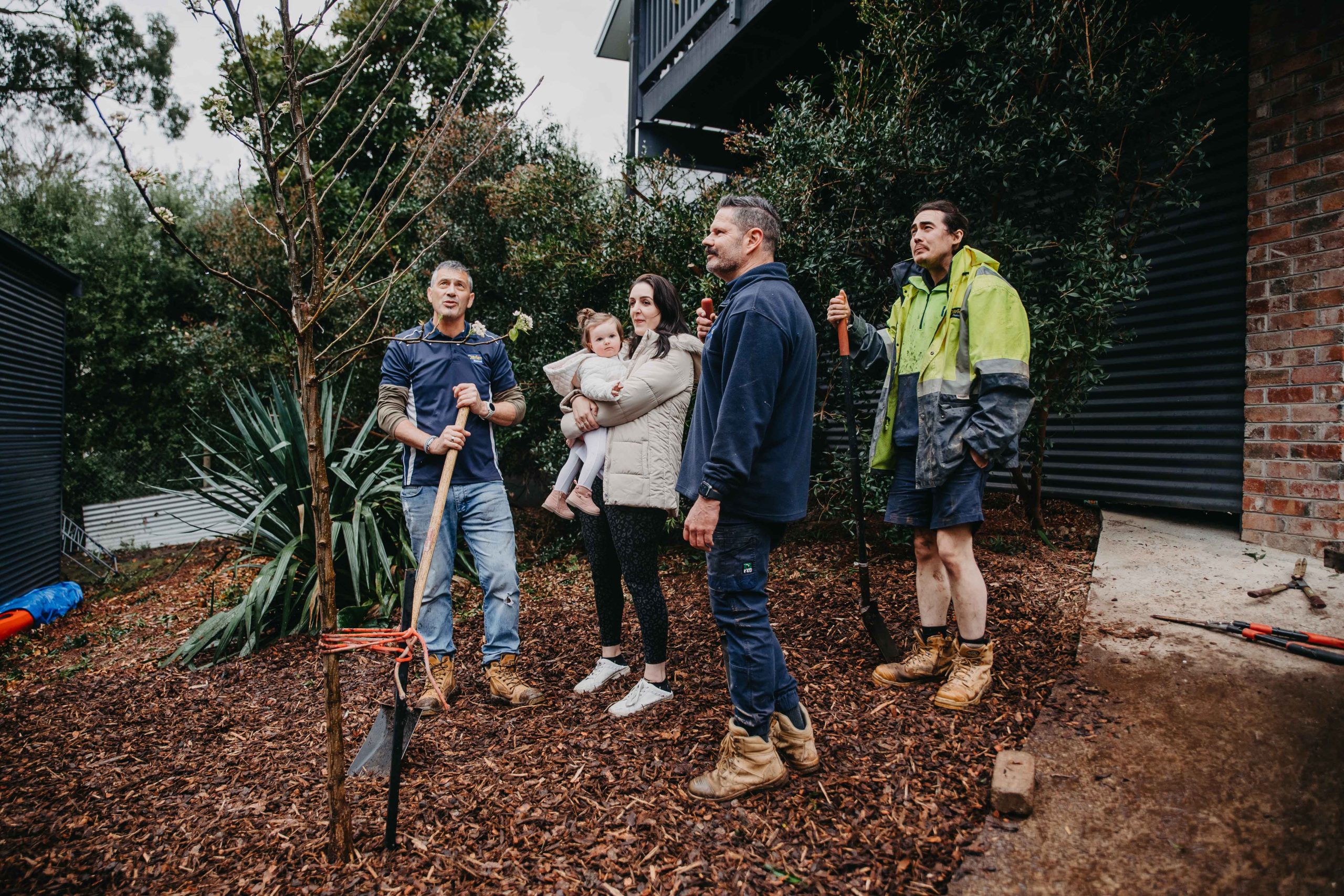 The team with Holly in the yard