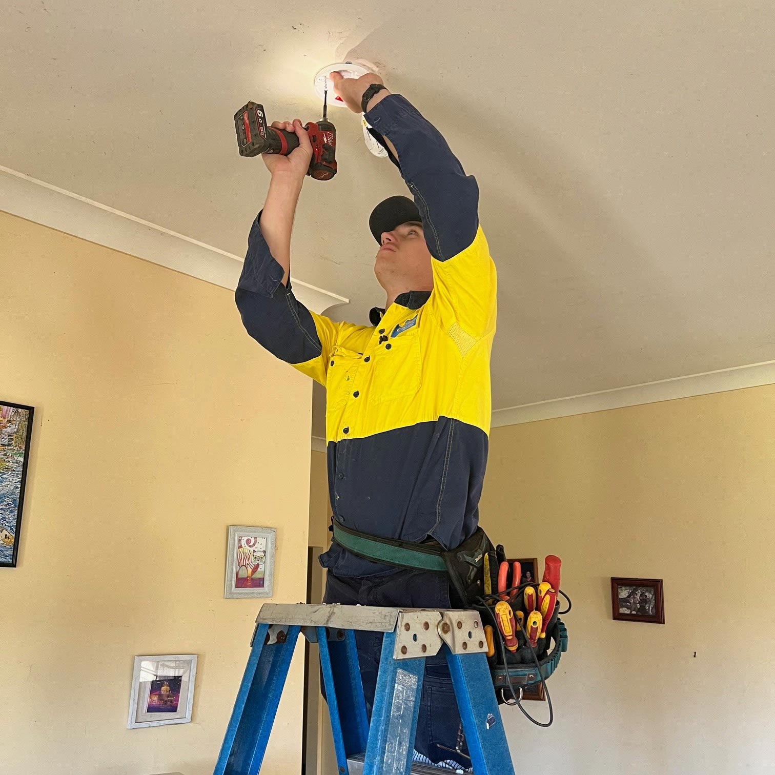 Electrician Drilling On The Ceiling