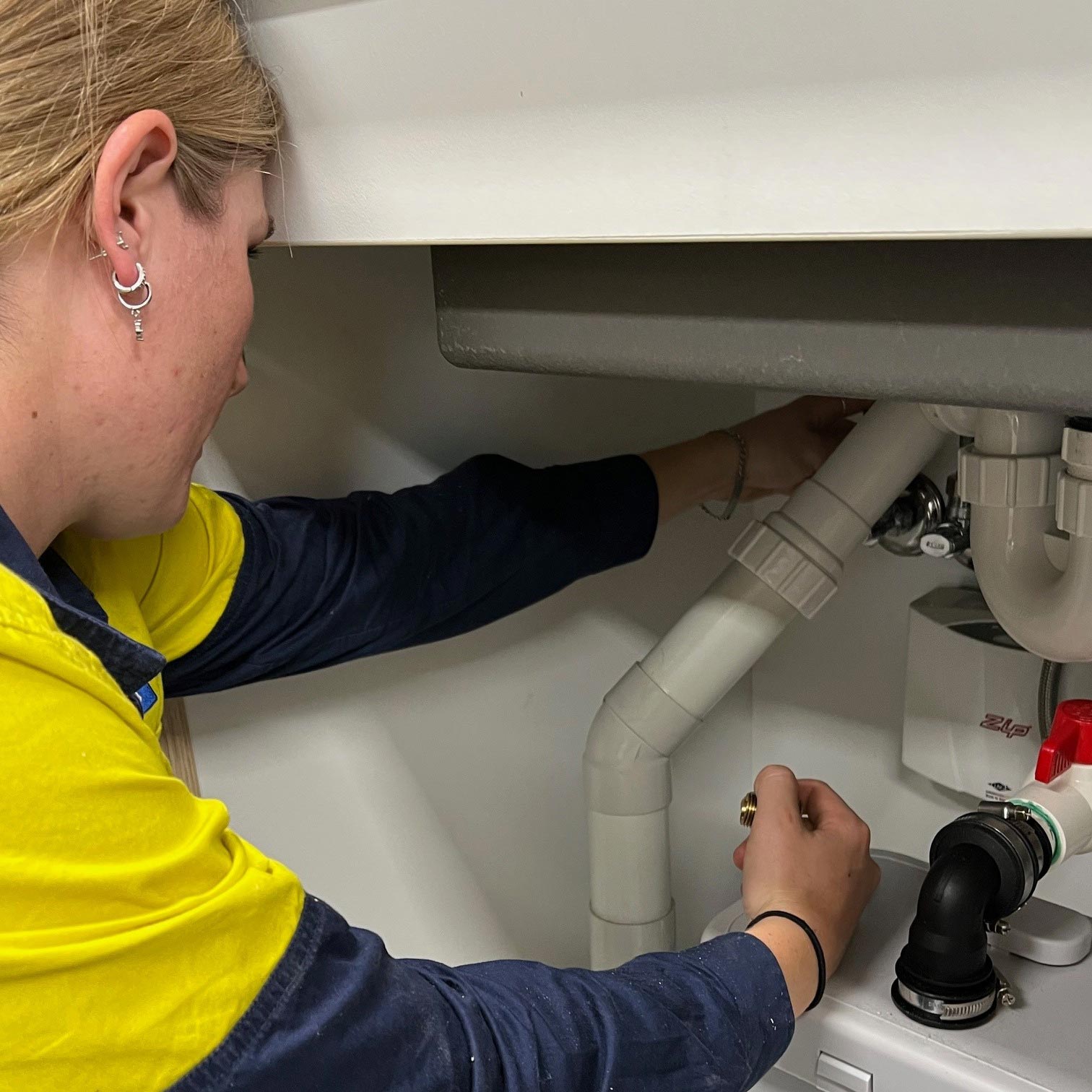 Plumber Checking Pipes