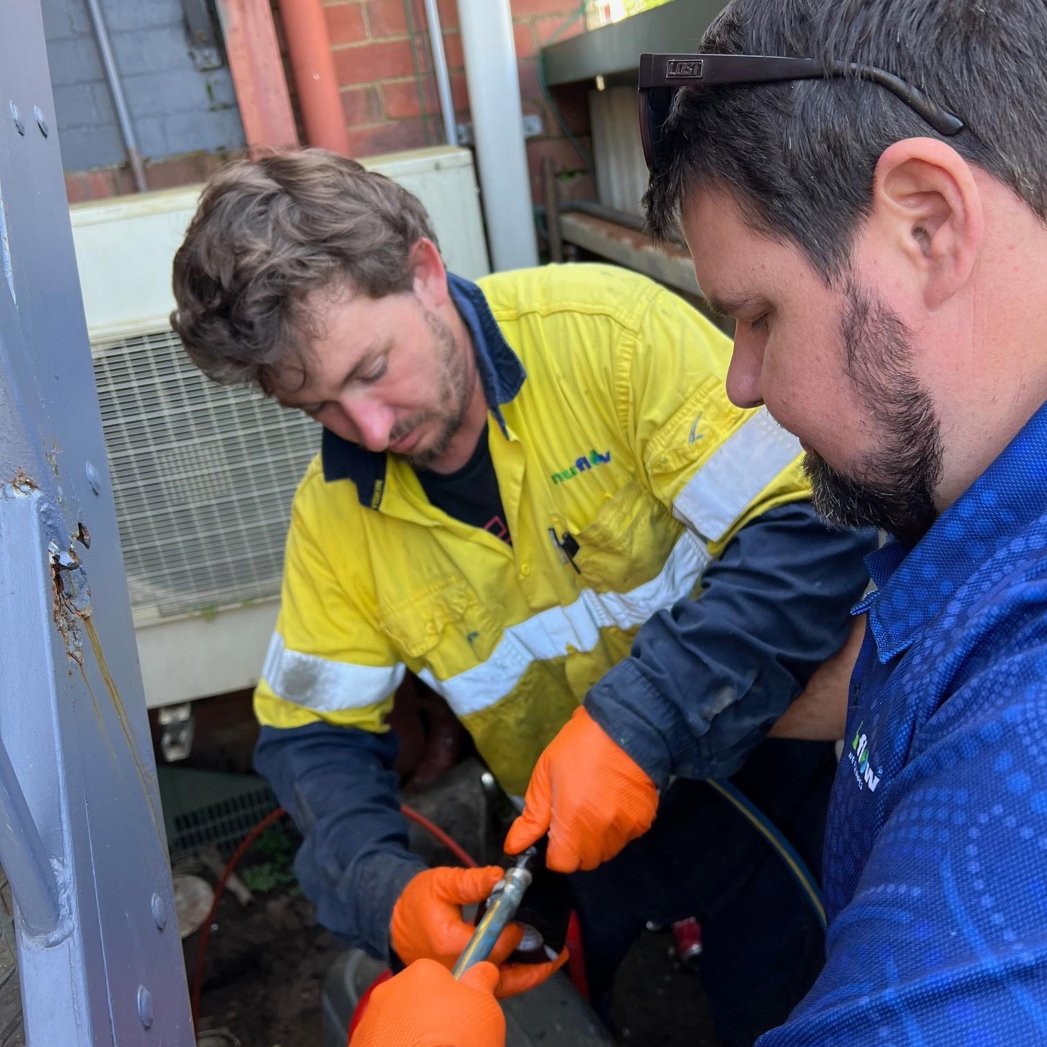 Plumbers Checking Pipes